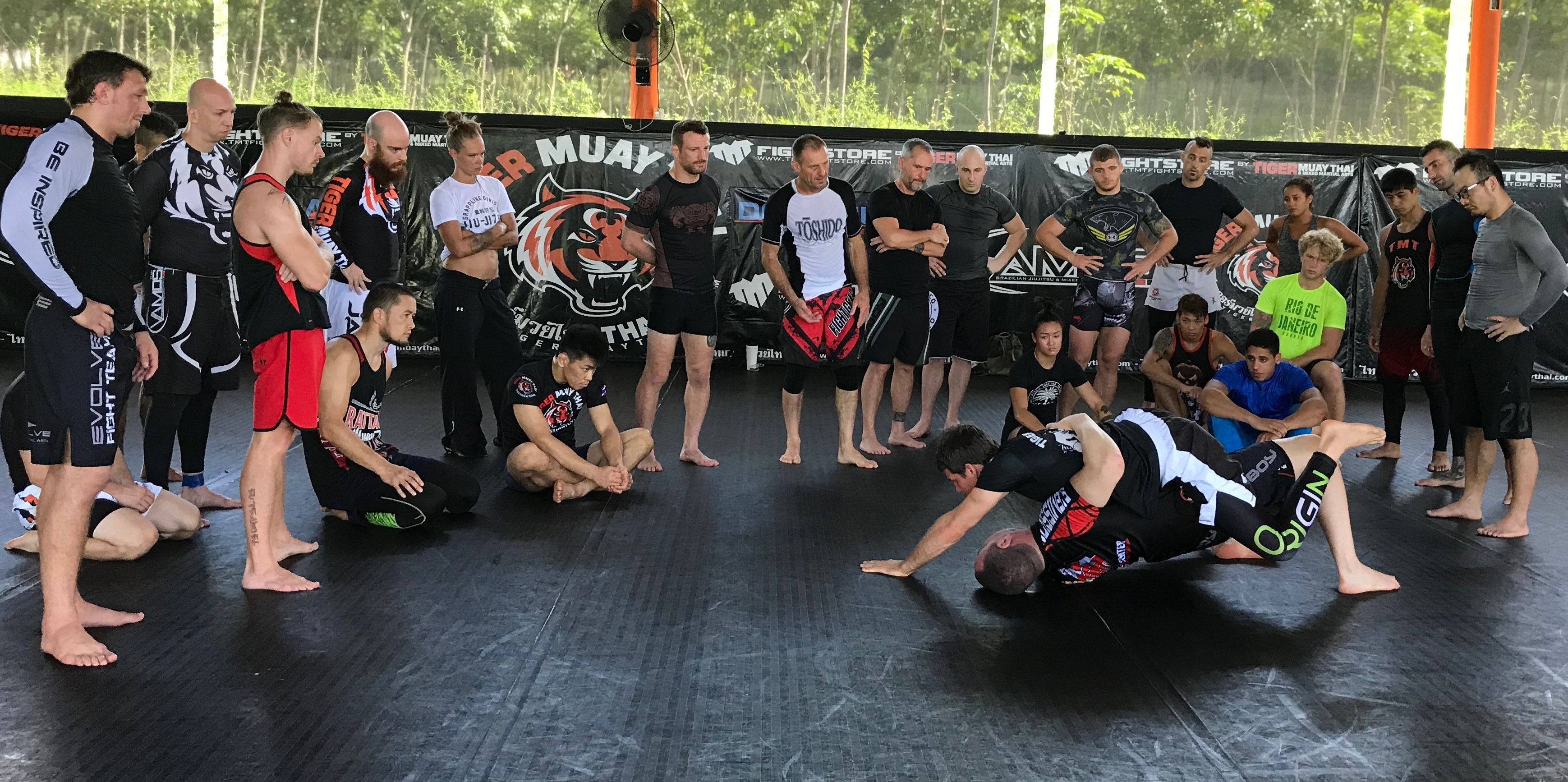Professor Scott Tannenbaum teaching a No-Gi seminar to a full class at Tiger Muay Thai in Thailand